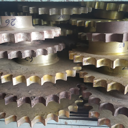Industrial V-belts, pulleys and rubber belts stacked on shelves